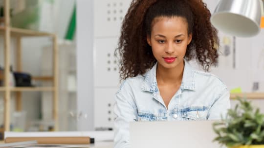 Woman sitting in front of computer