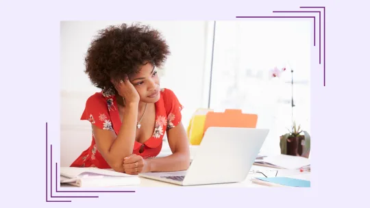 woman on laptop looking frustrated