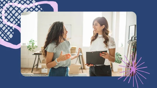 two women talking at work