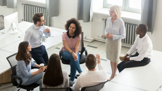 group of employees discussing how to start a union