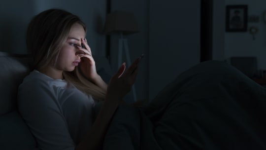 Sad woman on phone