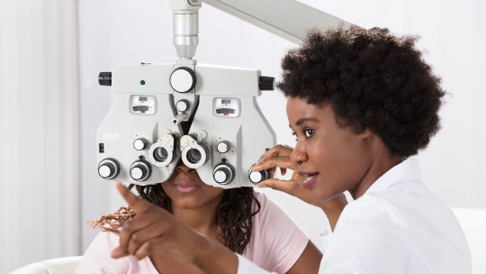 optometrist examining patient