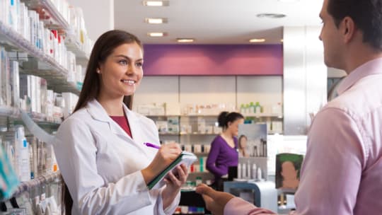 pharmacist working with a patient