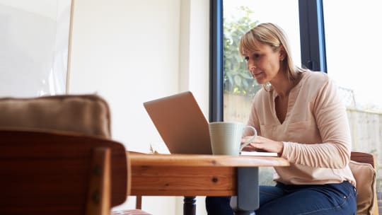 woman looking at laptop