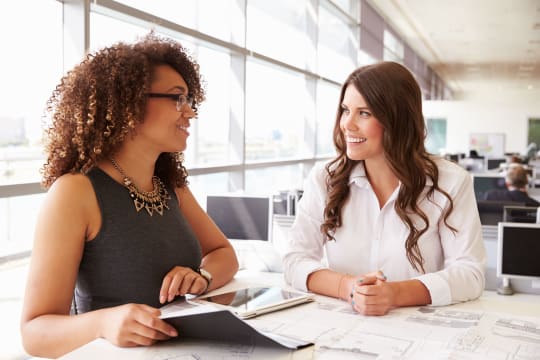 Women sit and talk