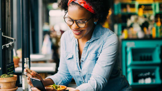 Woman eating at cafe