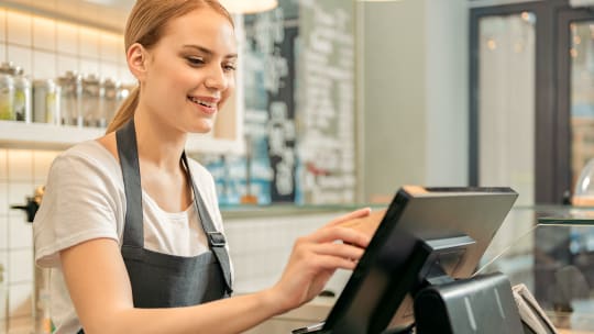 cashier ringing up sale