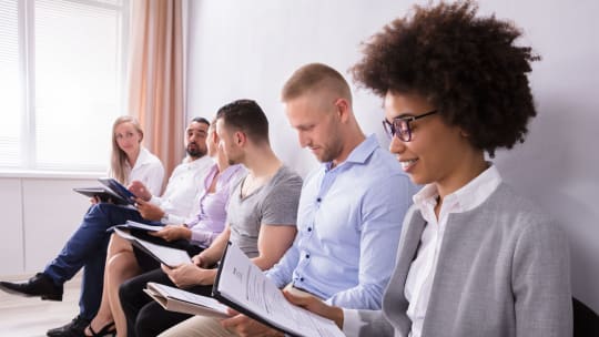 woman looking over her resume before interview