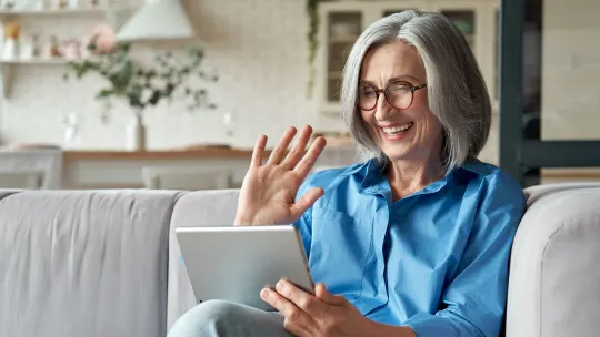 woman on her laptop attending virtual career fair