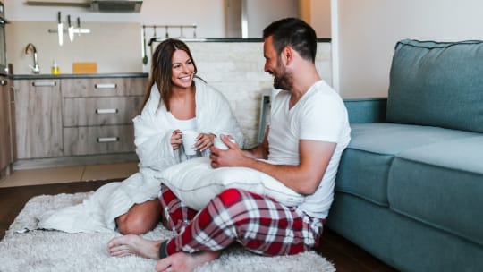 Couple talking on floor