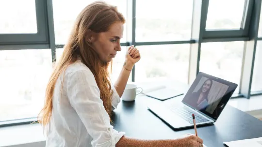 Serious woman on video call