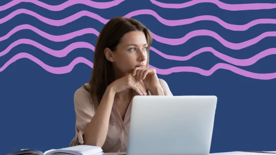 a woman looking off into the distance. a laptop is pictured in front of her.