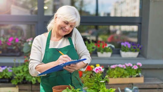 senior working in a plant nursery