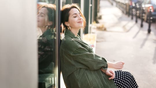 Woman putting on makeup