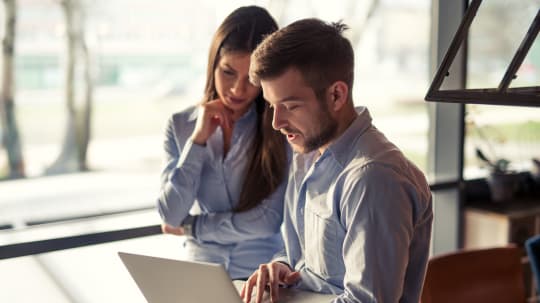 Man and woman in office