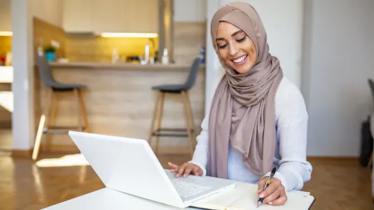 woman writing a cover letter
