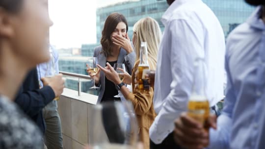 Women laughing and drinking wine