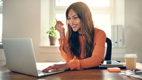 Woman looking at laptop