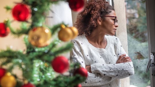 Woman staring out window