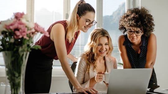 Happy women at work