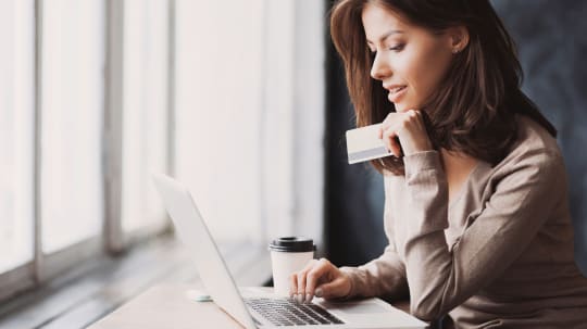 Woman holding credit card