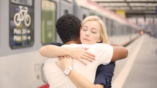 Couple saying goodbye at the train