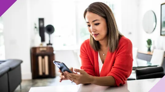 Woman on the phone at the kitchen counter