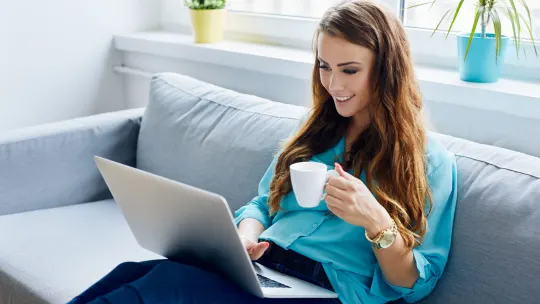 Happy woman on laptop