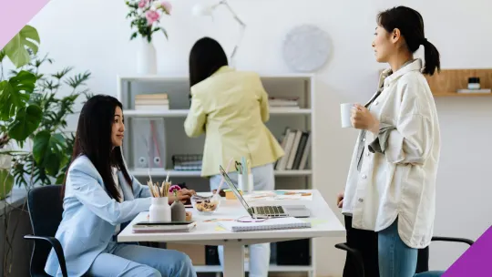 Group of coworkers talking and laughing