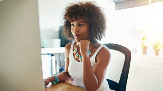 Woman writing on computer