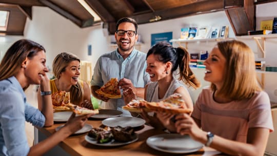 employees eating pizza