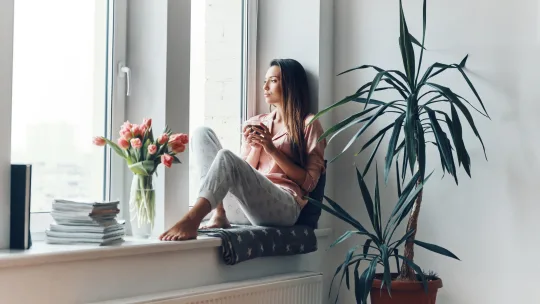 Woman looking out window