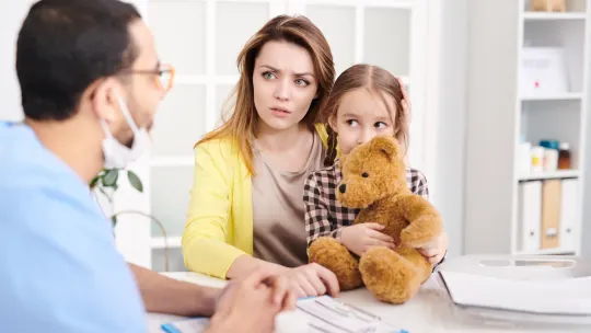 Frustrated mom at doctor