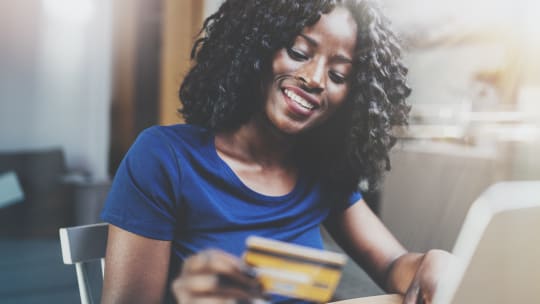 woman holding credit card