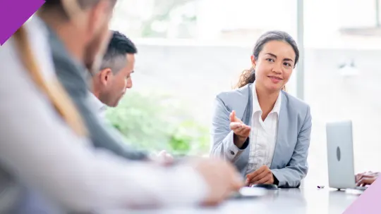 Professional in a meeting, representing the dynamic workplace of introverted extroverts