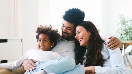 Parents and child watching TV