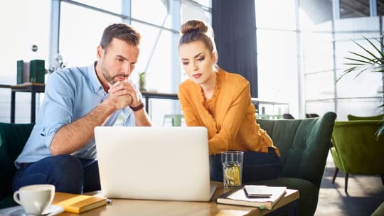 Male and Female Colleague Talking