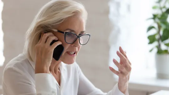 Frustrated woman on the phone