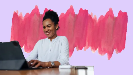 Woman smiling at tablet