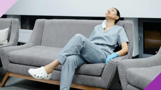 A nurse resting on a sofa to illustrate the importance of knowing the most common career change for nurses, in case you're ready to leave this field