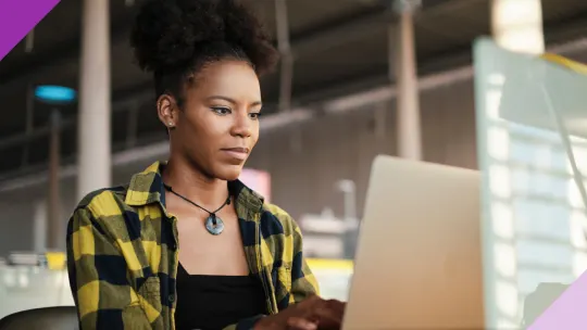 Professional person typing on a computer, illustrating this guide on how to end an email