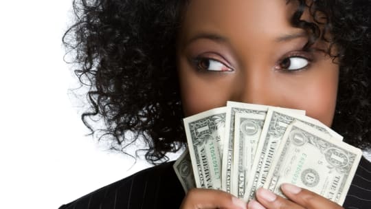 woman holding dollar bills