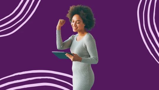 a woman celebrating at work
