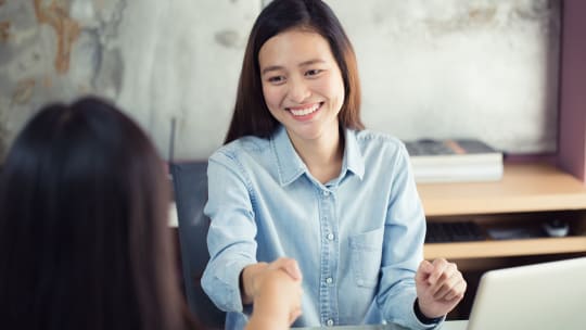Women shaking hands