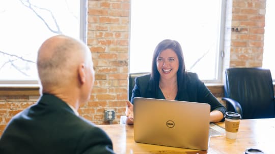 A woman is interviewed for a job
