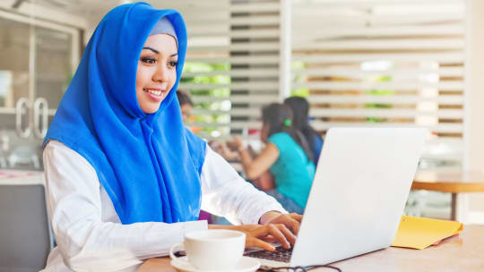 Happy woman with computer