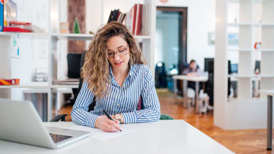 Woman writing goals