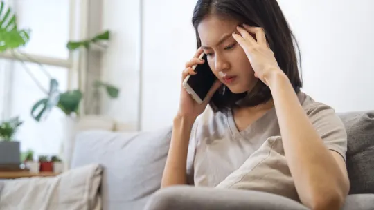 Frustrated woman on phone