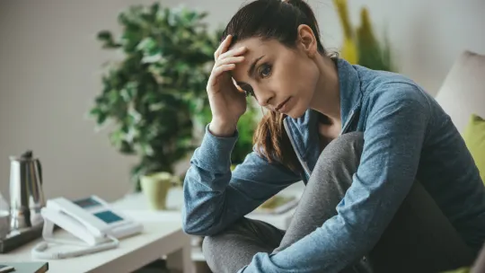 Stressed woman sitting in chair