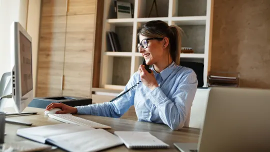Happy woman on computer